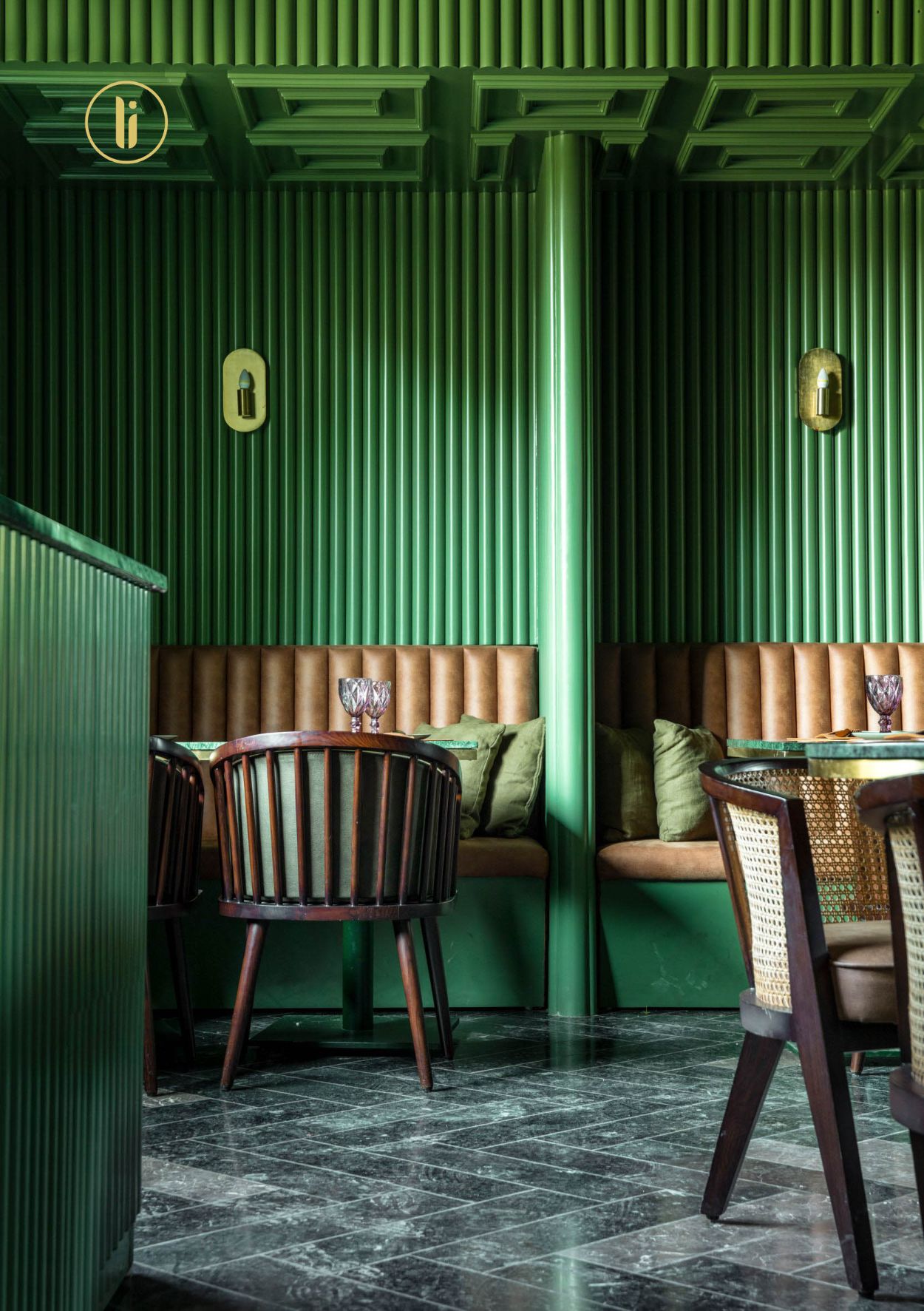 Chic cafe interior with pastel green colors and modern art